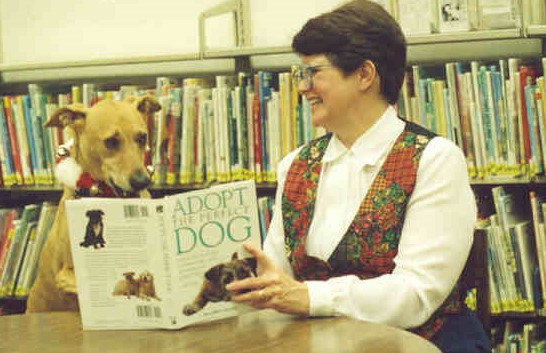 Buster making the librarian laugh during the fundraising event.